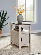 Chair side end table in light brown wood with open shelf and cabinet door with black pull