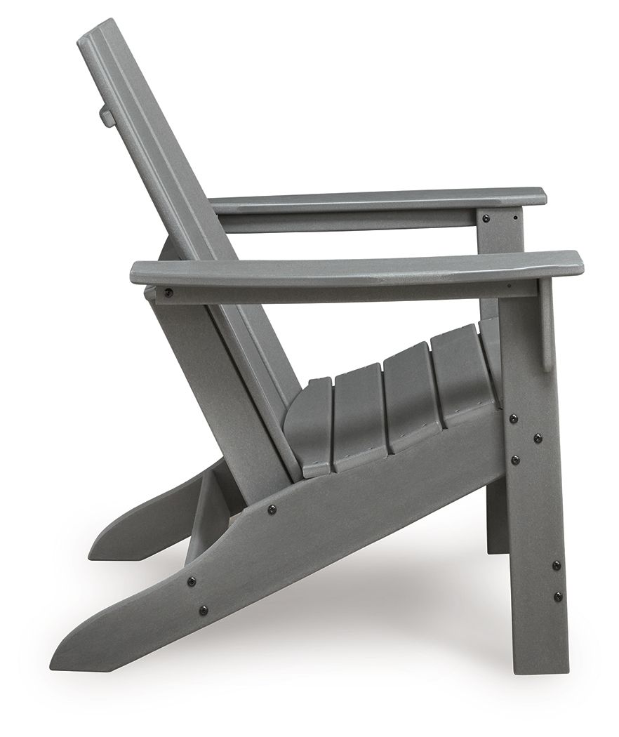 Gray Adirondack chair angled view, slatted seat and back with armrests