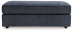 Oversized accent ottoman in cobalt blue upholstery with thick top cushion and legs