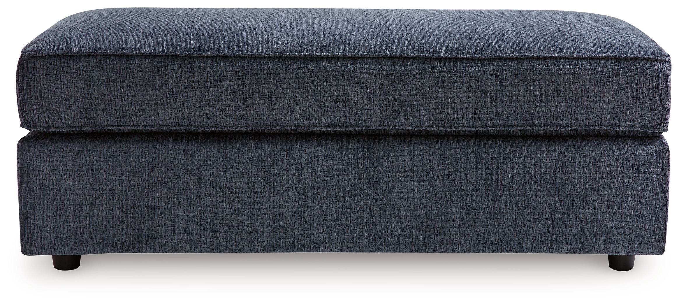 Oversized accent ottoman in cobalt blue upholstery with thick top cushion and legs