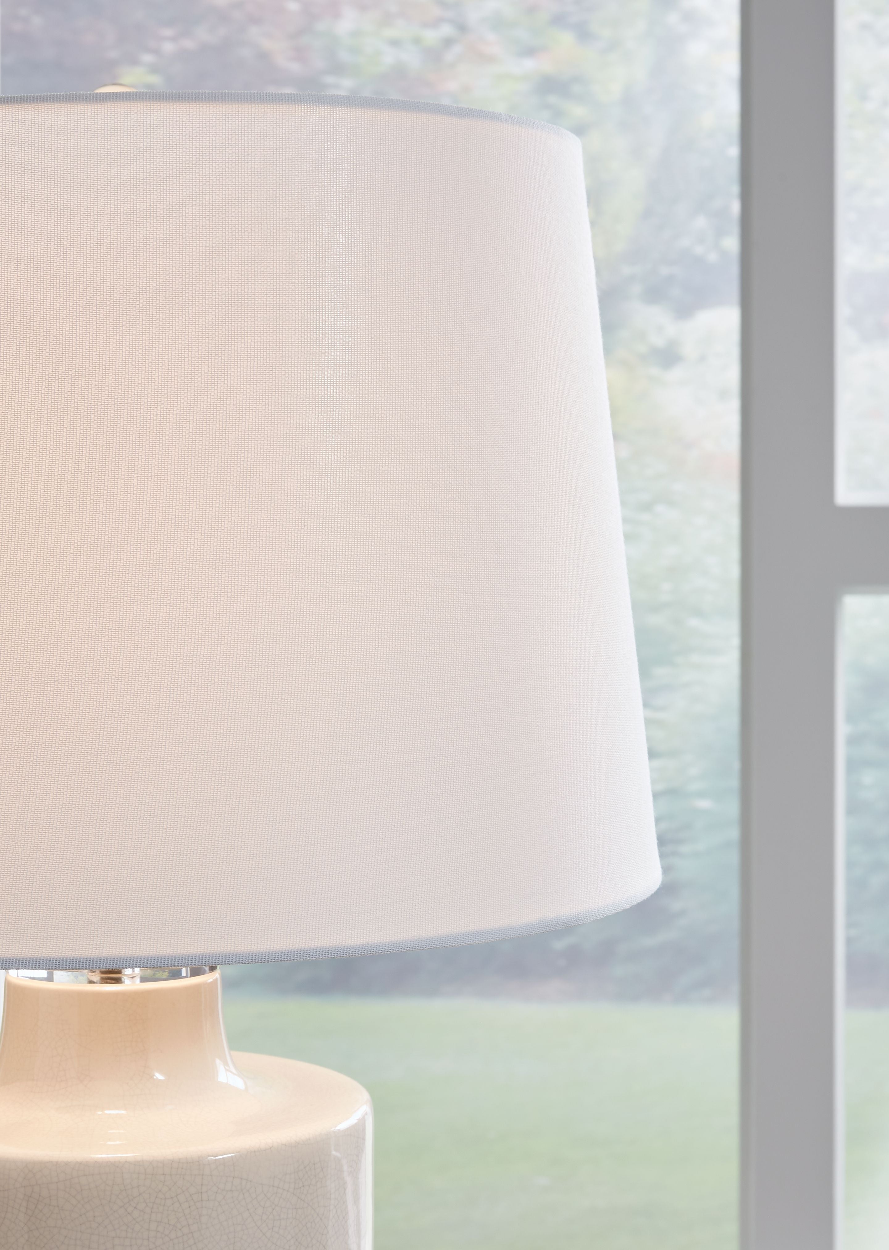 Off-white drum fabric lampshade on ceramic lamp base
