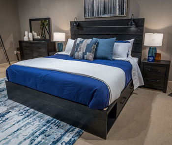 Dark gray bed frame with side storage rails and upholstered headboard