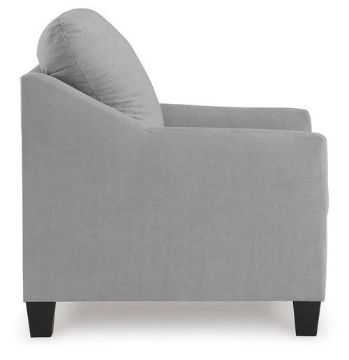 Upholstered armchair in light gray with rounded seat and back, visible side profile.