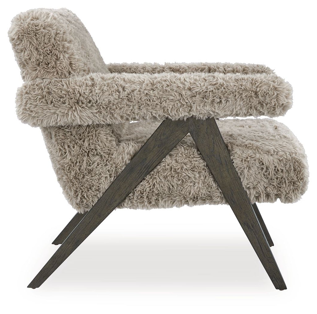 Light gray shag accent chair with wide arms and dark X-style base