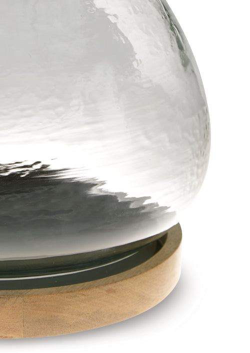 Clear glass vase candle holder with greenish base ring and round wooden base