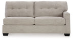 Pebble light-gray raf sofa, tufted back, track arms, black feet