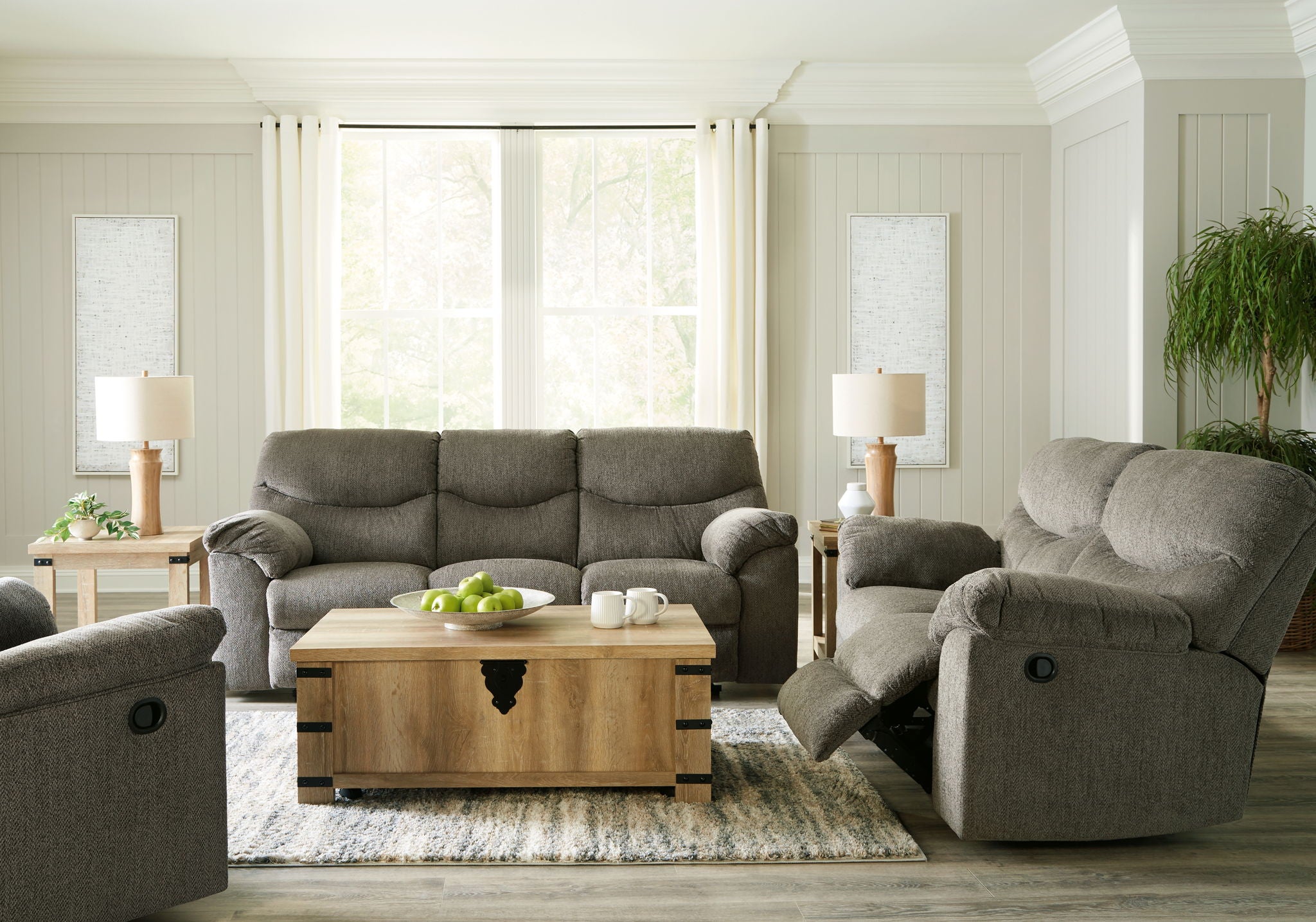 Upholstered sofa and recliner set in neutral fabric, padded arms and cushions