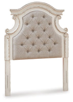 Upholstered twin headboard with button-tufted beige fabric and chipped white carved frame