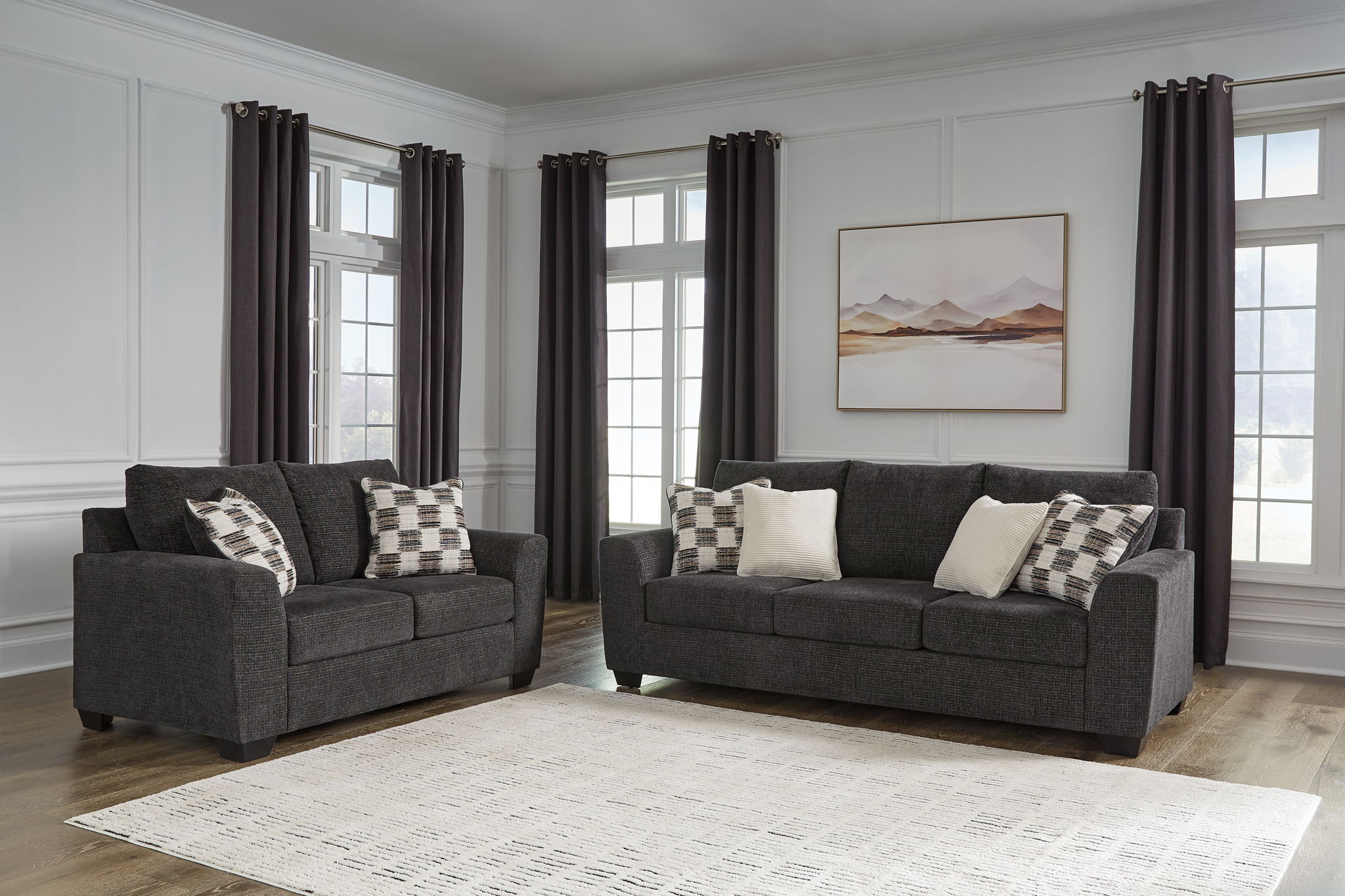 Loreo living room set dark gray sofa and accent chair with patterned throw pillows