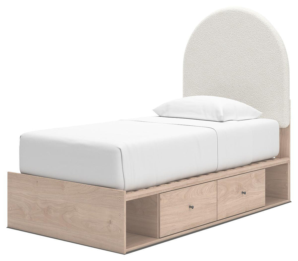 Beige upholstered panel bed with arched headboard, white mattress, and two front drawers in wood base