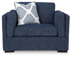 Blue armchair with square arms and a striped throw pillow