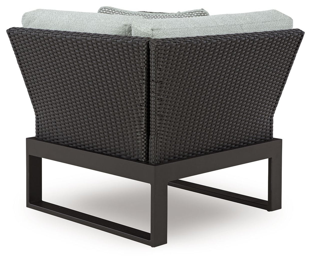 Black outdoor corner chair with gray seat cushion and woven back