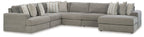 Gray sectional sofa with chaise corner and multiple striped accent pillows