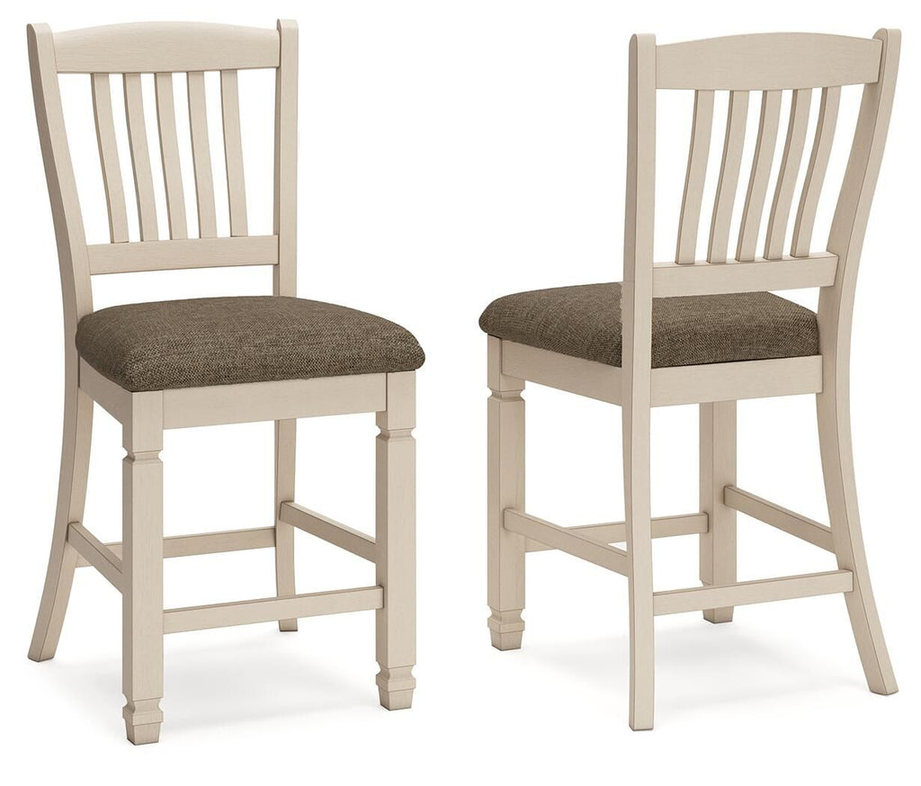 Pair of beige barstools with slatted backs and padded, dark fabric seats