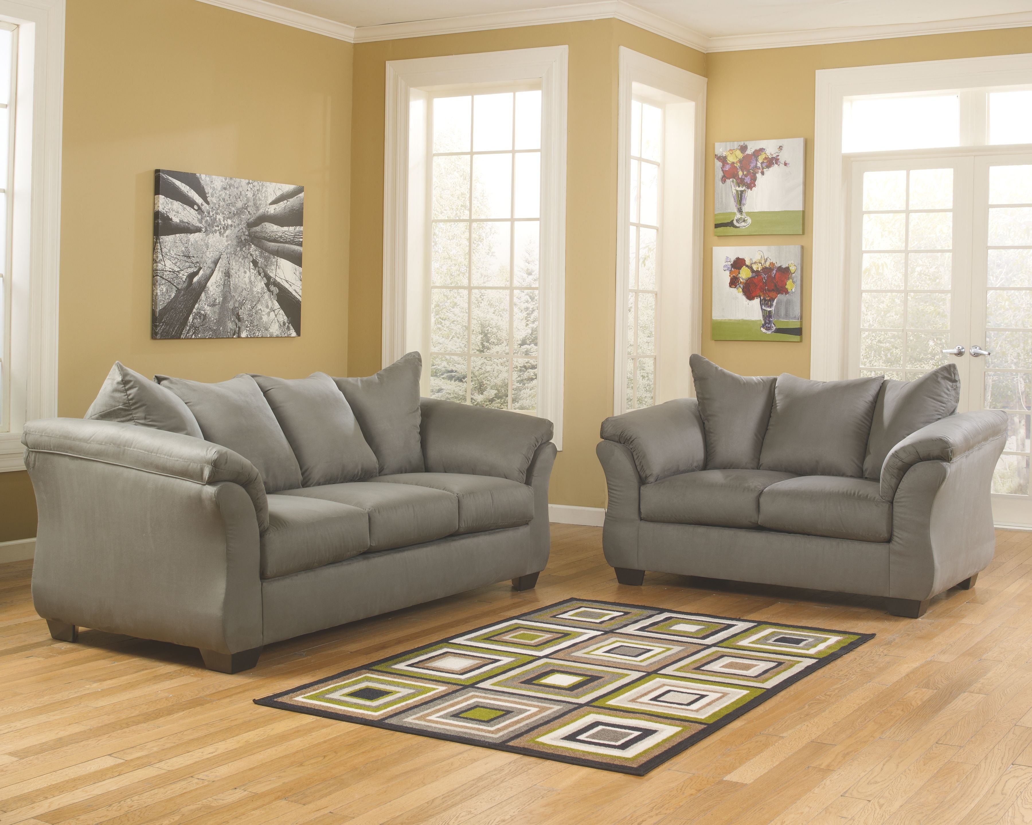 Living room set with gray sofa and loveseat, padded arms, and tufted back cushions