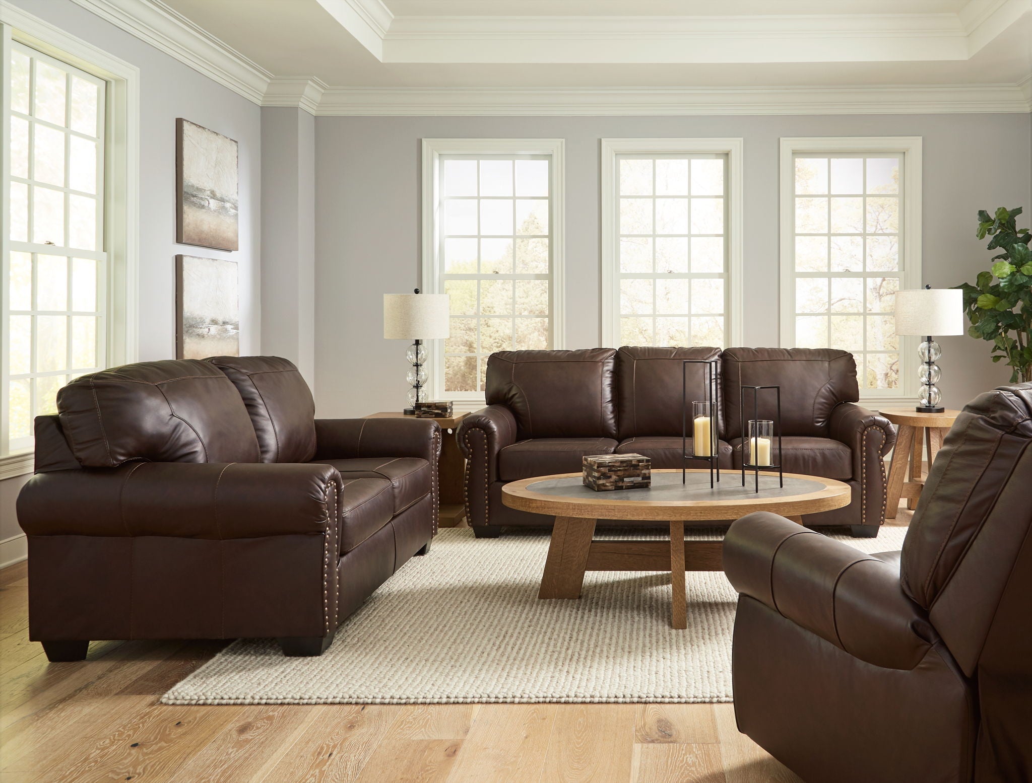 Dark brown upholstered seating set with loveseat, sofa, and recliner chairs