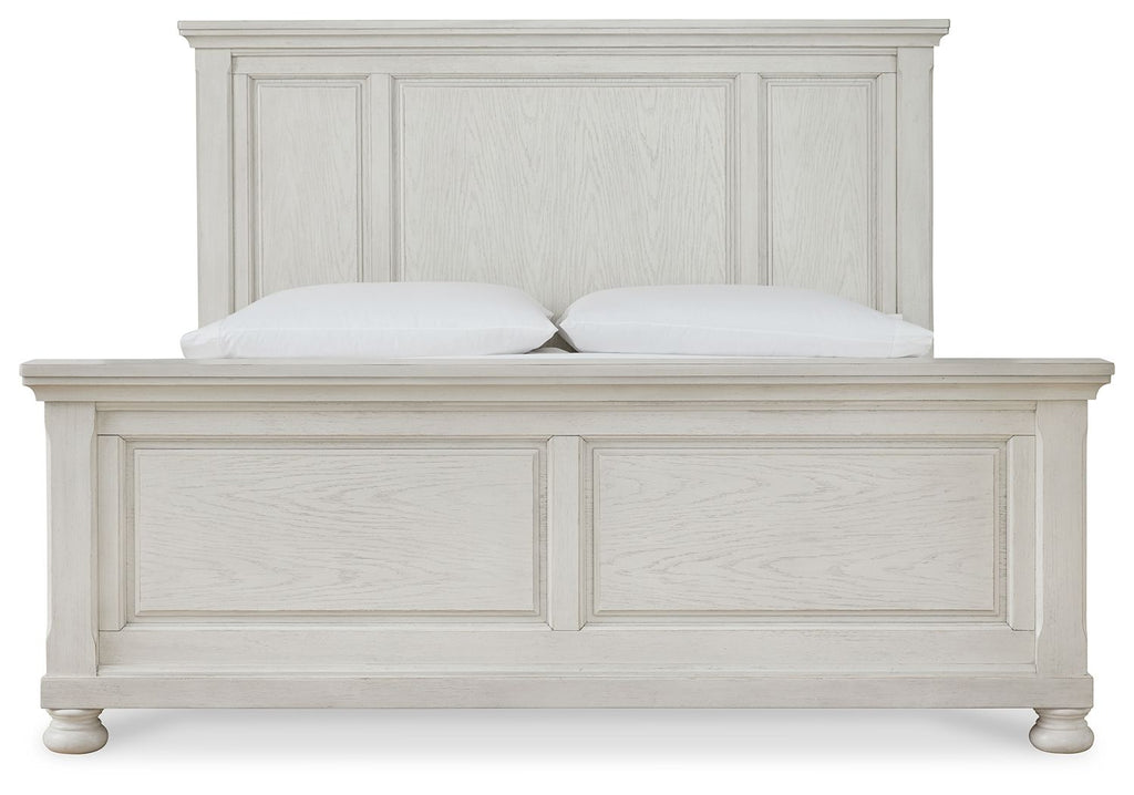 White panel bed frame close-up, paneled headboard and footboard with two pillows