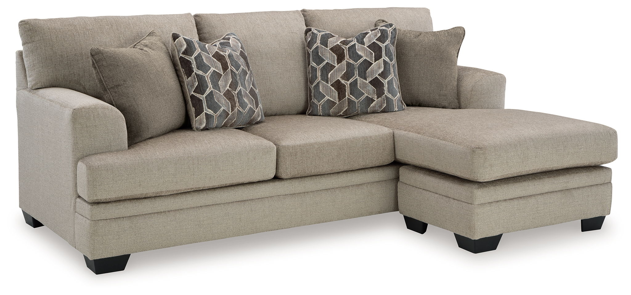 Corner sectional sofa with chaise, light gray upholstery and multiple patterned throw pillows