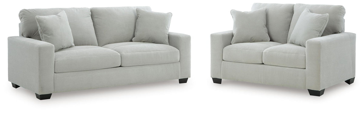 Light gray sofa and loveseat set with square arms and three seat cushions each