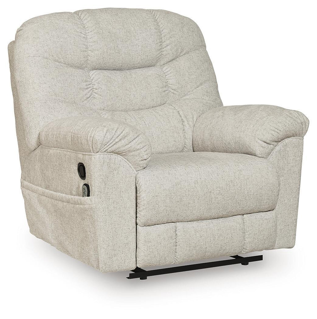 Light beige upholstered zero-wall recliner with tufted cushions, rounded armrests, and base