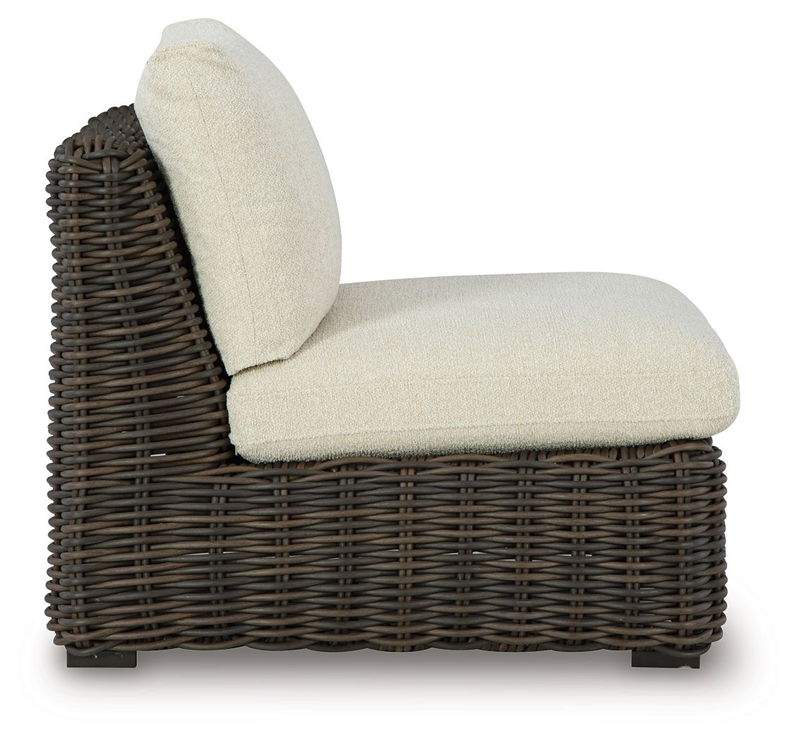 Armless wicker chair with beige seat and back cushions, dark brown woven frame