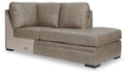 Corner chaise lounge with taupe fabric upholstery and track arms, dark base feet.