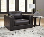 Amiata onyx chair and a half in dark leather with cushioned back and seat.