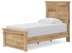 Light brown panel bed with paneled footboard and white mattress with pillows