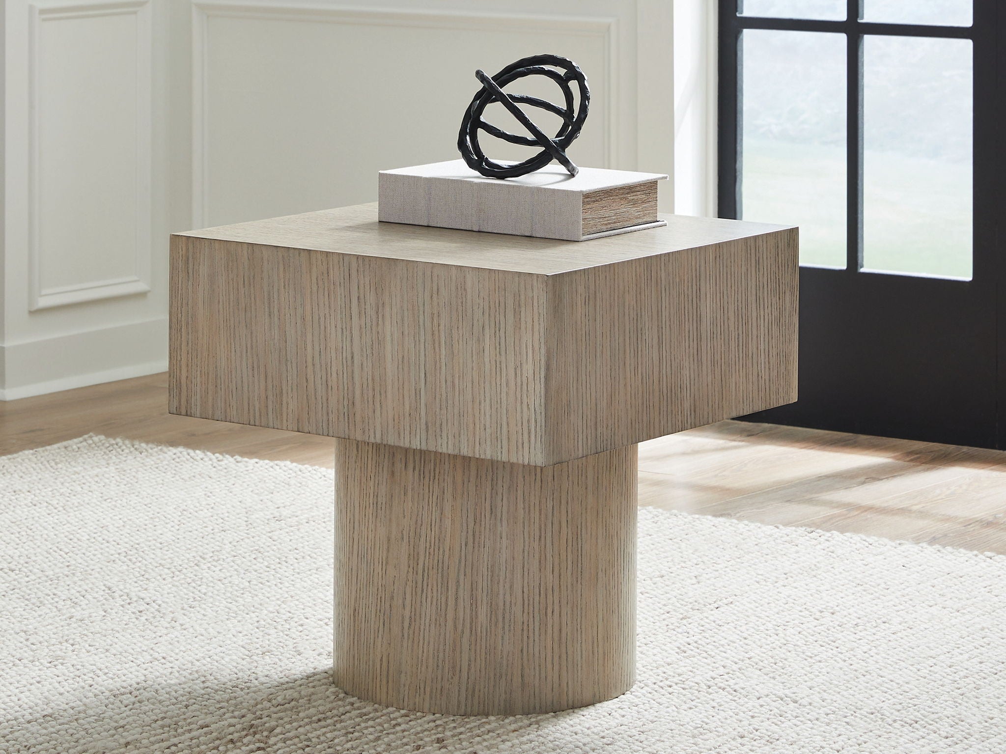 Light brown square end table with pedestal base and wide top