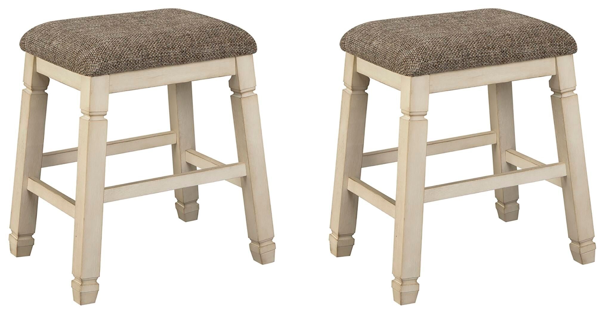 Pair of upholstered stools with textured neutral fabric seats and light wood turned legs