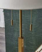 Gold metal lamp pole with two hanging pull cords under the shade edge.