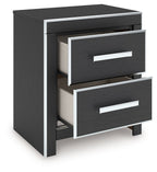 Black two-drawer night stand with two silver bar pulls, one drawer partially open