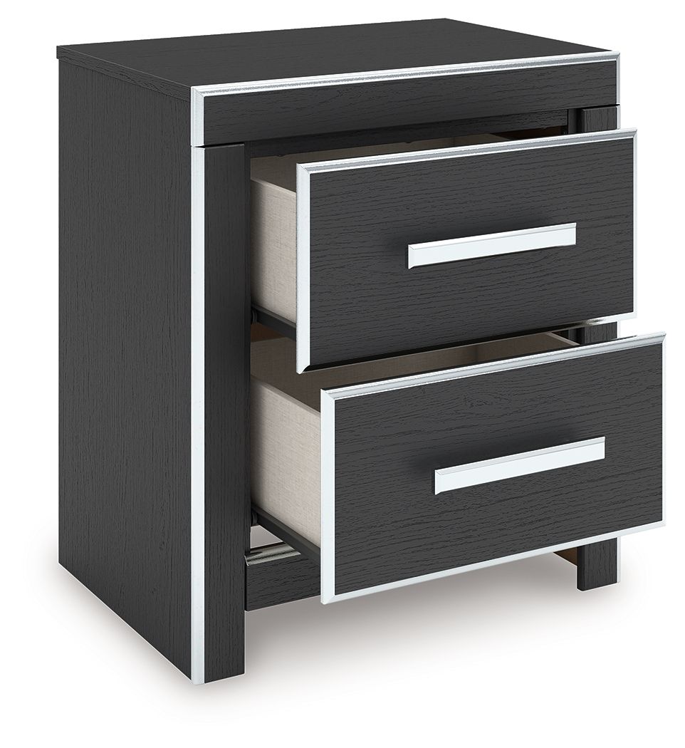 Black two-drawer night stand with two silver bar pulls, one drawer partially open