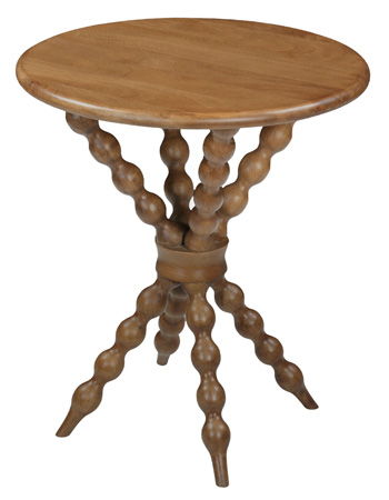 Light brown round accent table with carved turned legs