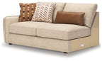 Sand LAF sofa with light beige fabric, back decorative pillows, boxy arms and seat cushions.