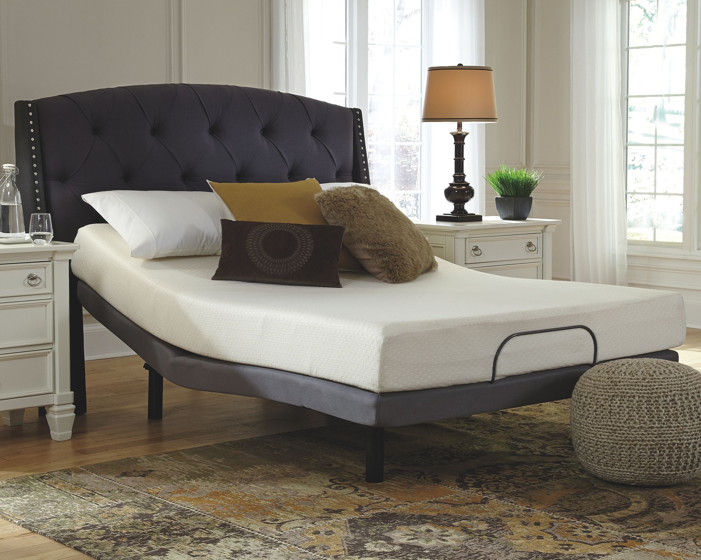 8-inch memory foam mattress with white cover on a platform bed frame