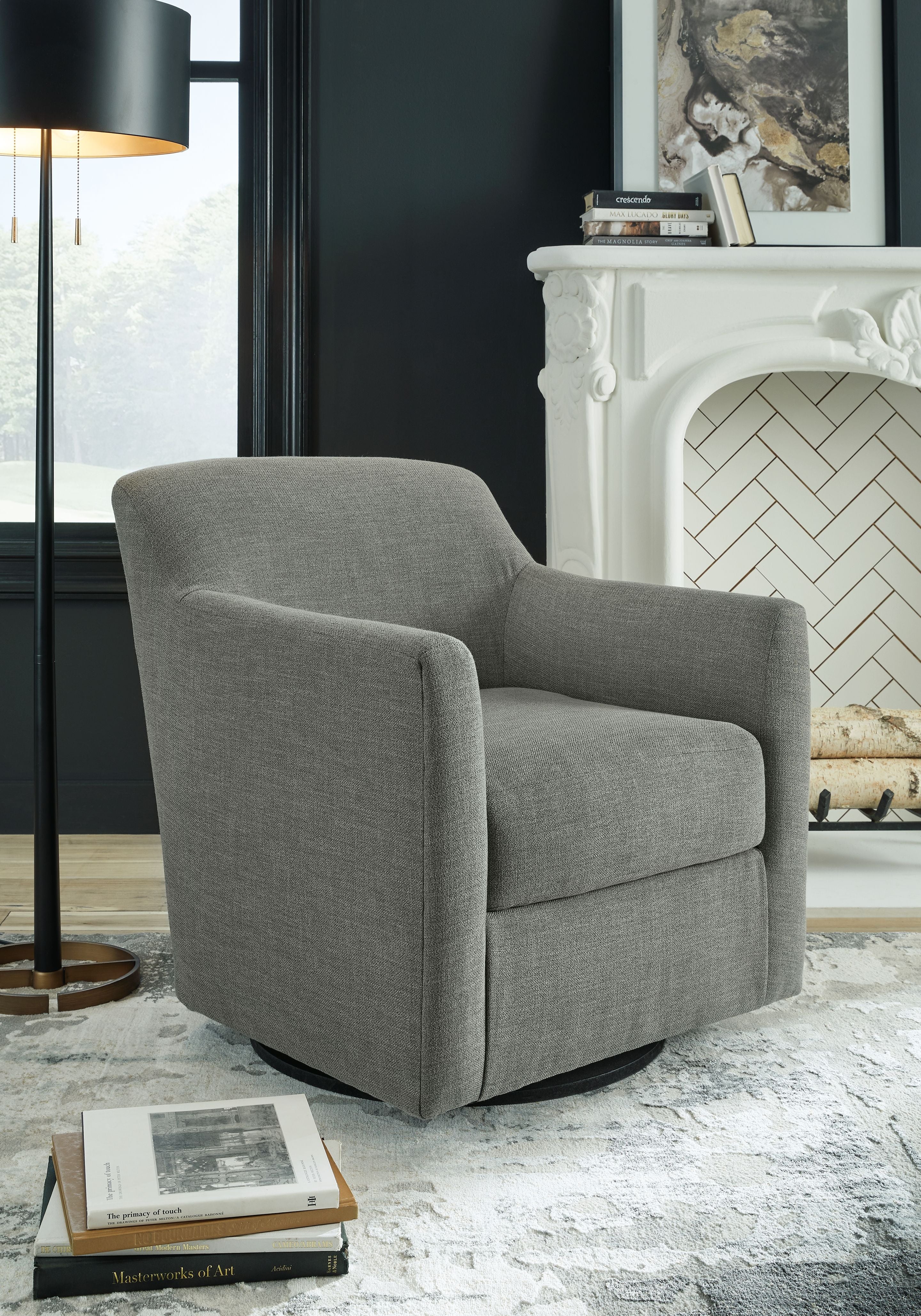 Gray swivel accent chair with wide armrests, cushioned seat, and rounded back