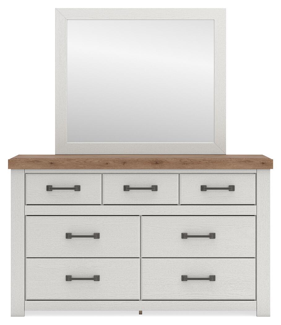 White dresser with wood top and six drawers with dark bar handles