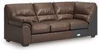 Umber sofa with corner wedge, tufted back cushions and rolled arms
