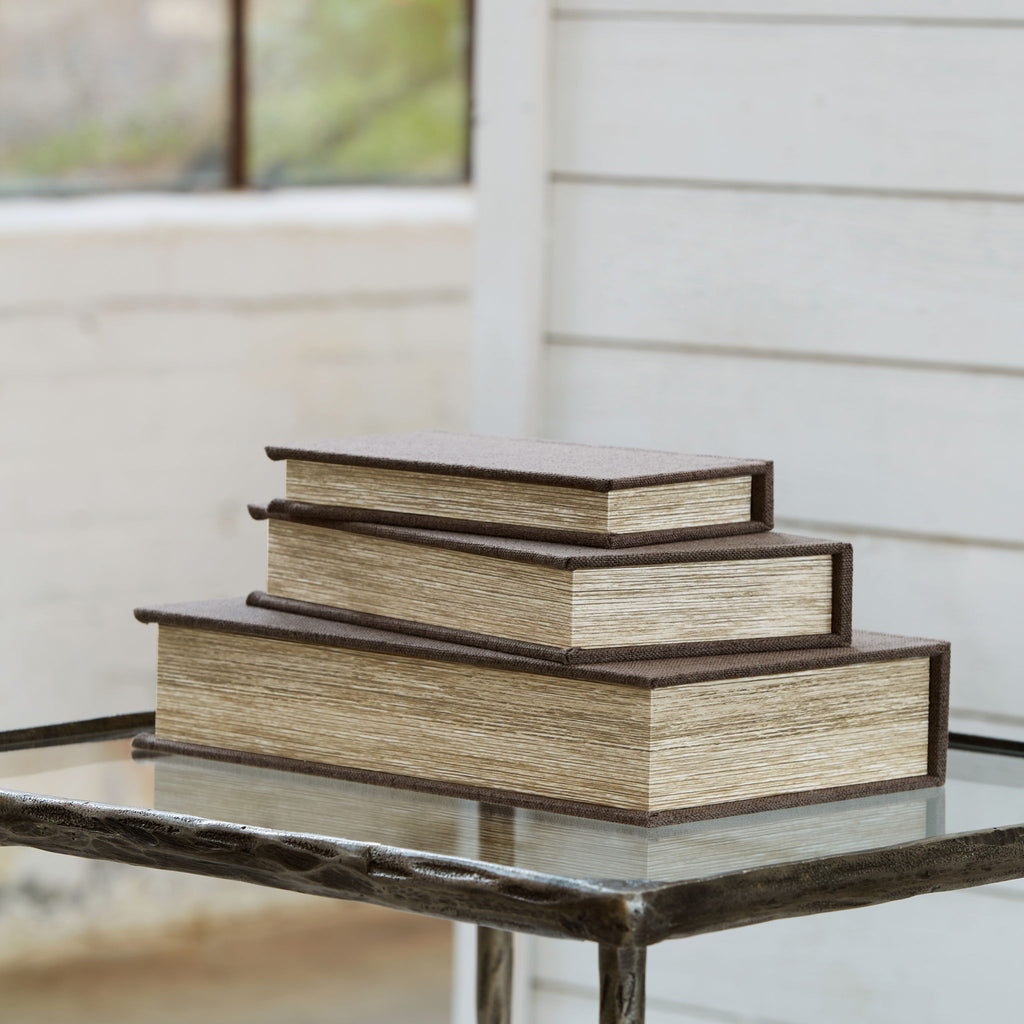 Wooden stacked storage boxes with a raised base and layered lids
