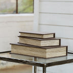 Wooden stacked storage boxes with a raised base and layered lids