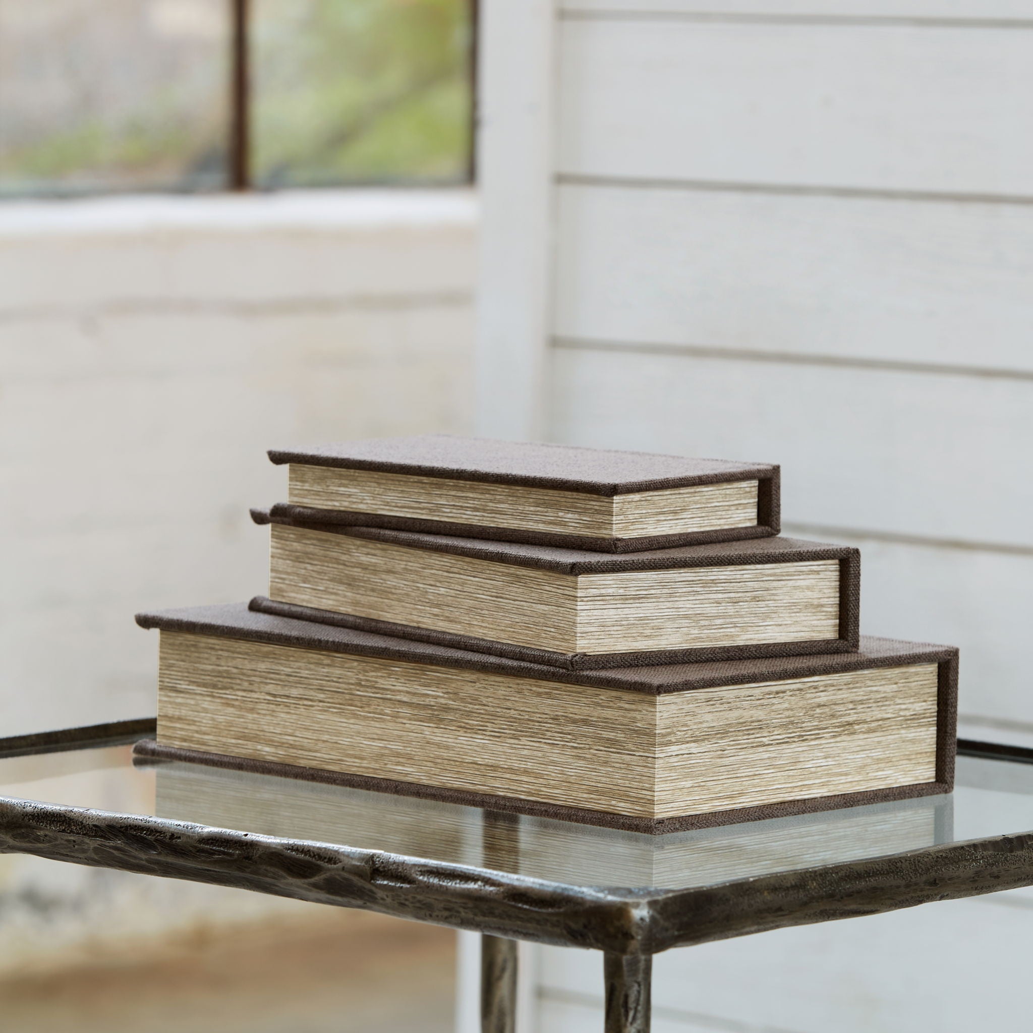 Wooden stacked storage boxes with a raised base and layered lids