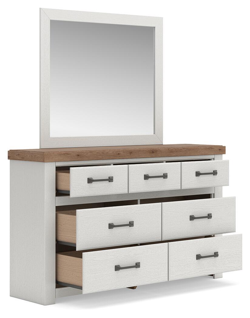 White dresser with wood top, open drawers, dark bar pulls