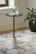 Round accent table with dark top, gold pedestal stem, and white conical base