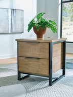 Light brown wood table with two drawers and black metal legs, shown with plant on top