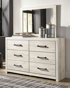 Beige dresser with mirror, six drawers and black bar handles