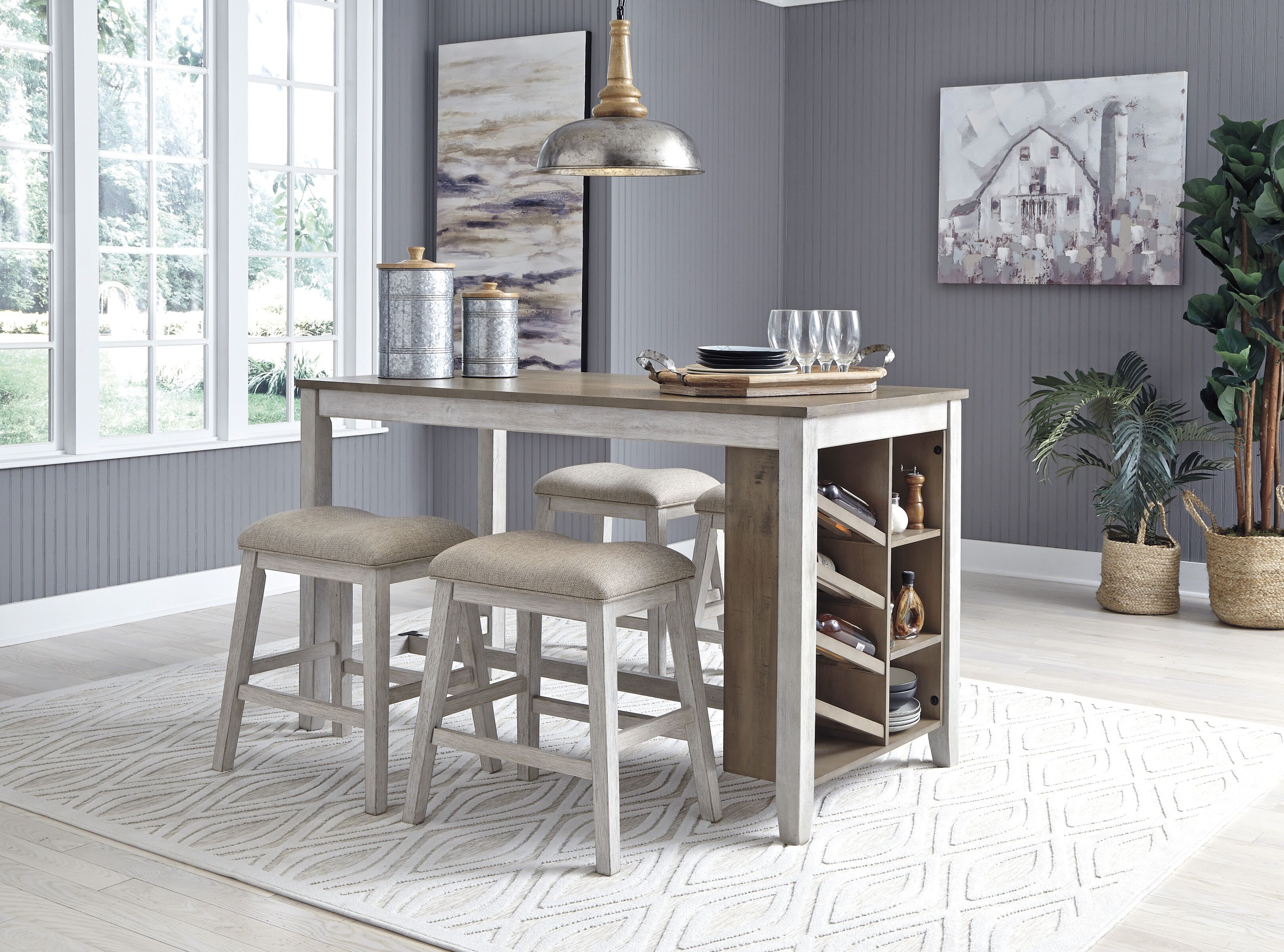 Rectangular counter table with storage, weathered gray finish, with two beige seat barstools