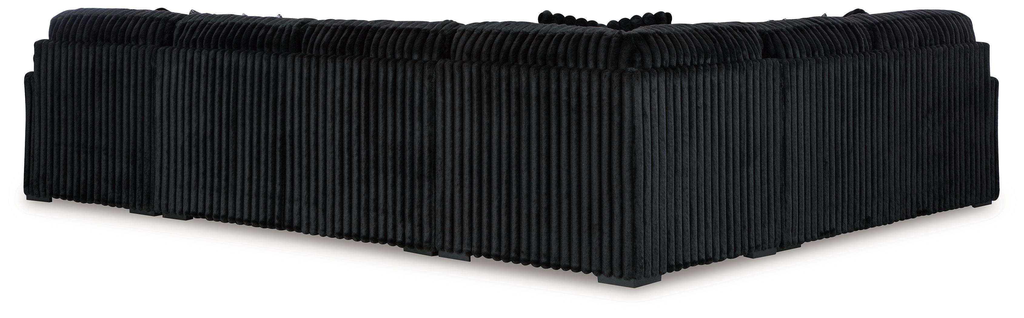 Black sectional sofa with ribbed upholstery and clean backrest cushion