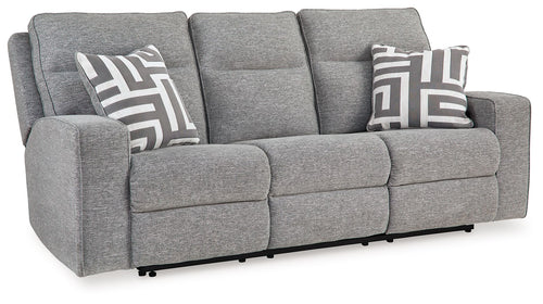 Pewter power reclining sofa in gray fabric with wide arms, patterned throw pillows, and headrests