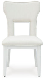White upholstered dining side chair with open-frame back and cushioned seat